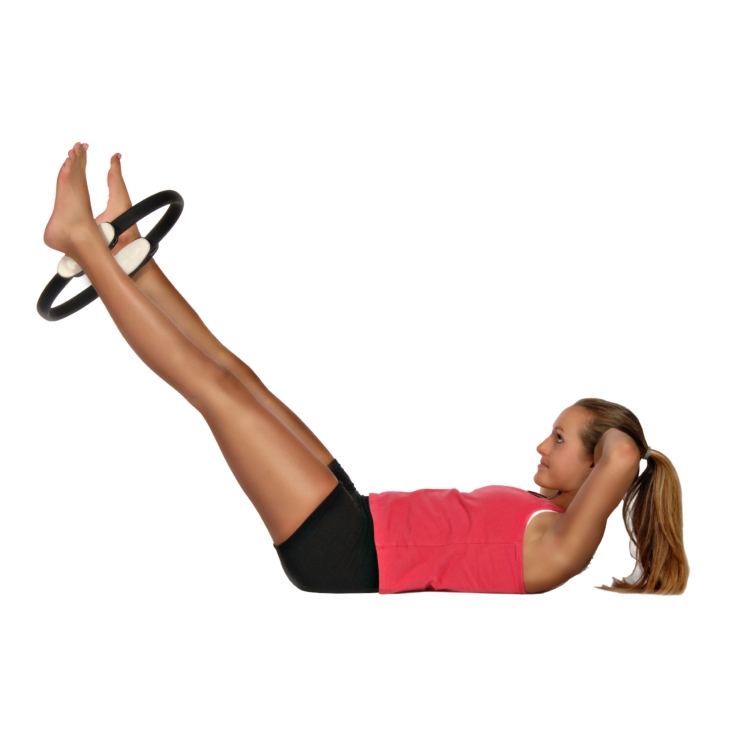Woman lying workout her legs on AeroPilates Magic Circle