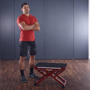 Middle age man standing at side on Intermediate Plyo Box Workout.