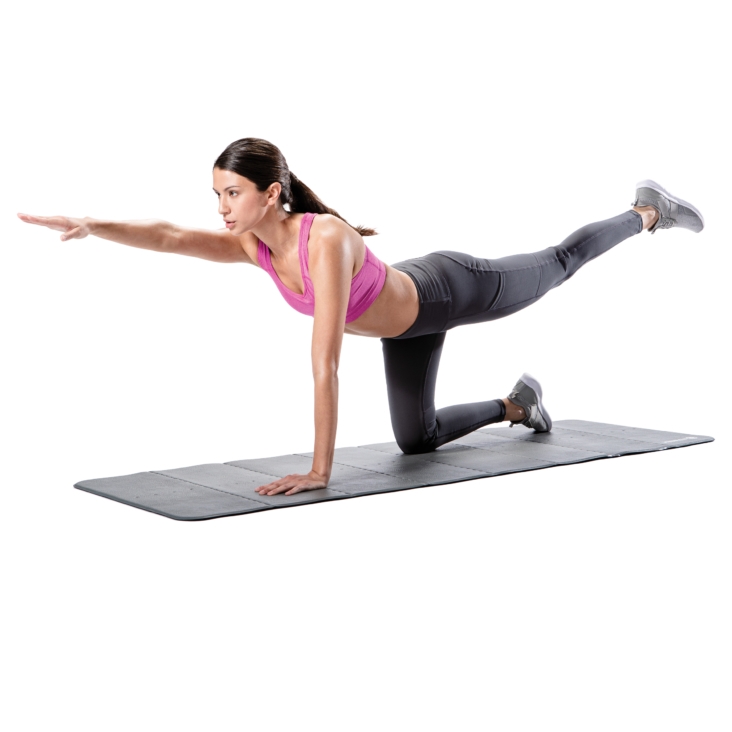 Kneeling woman lifting one arm forward and stretching leg backward