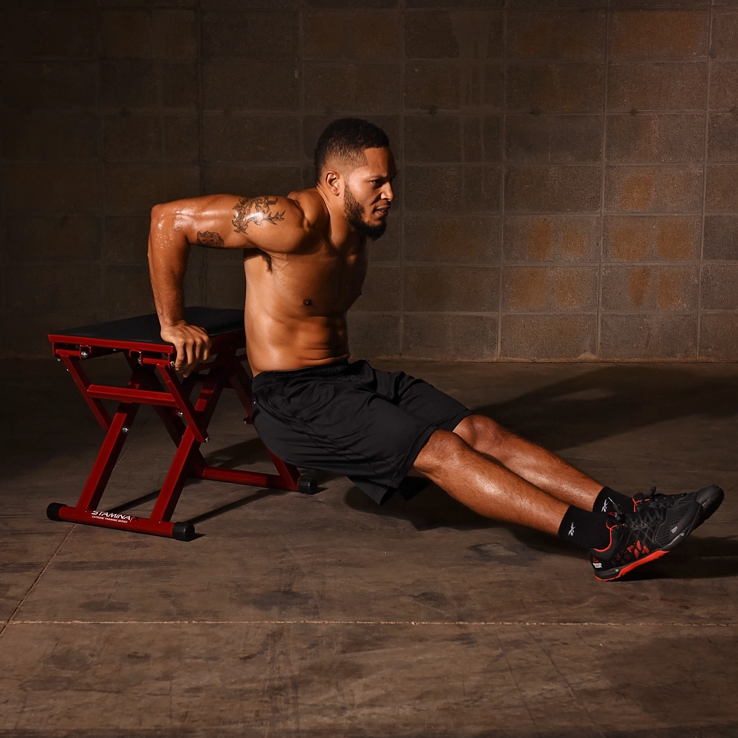Man performing dips on Stamina X Adjustable Plyo Box.