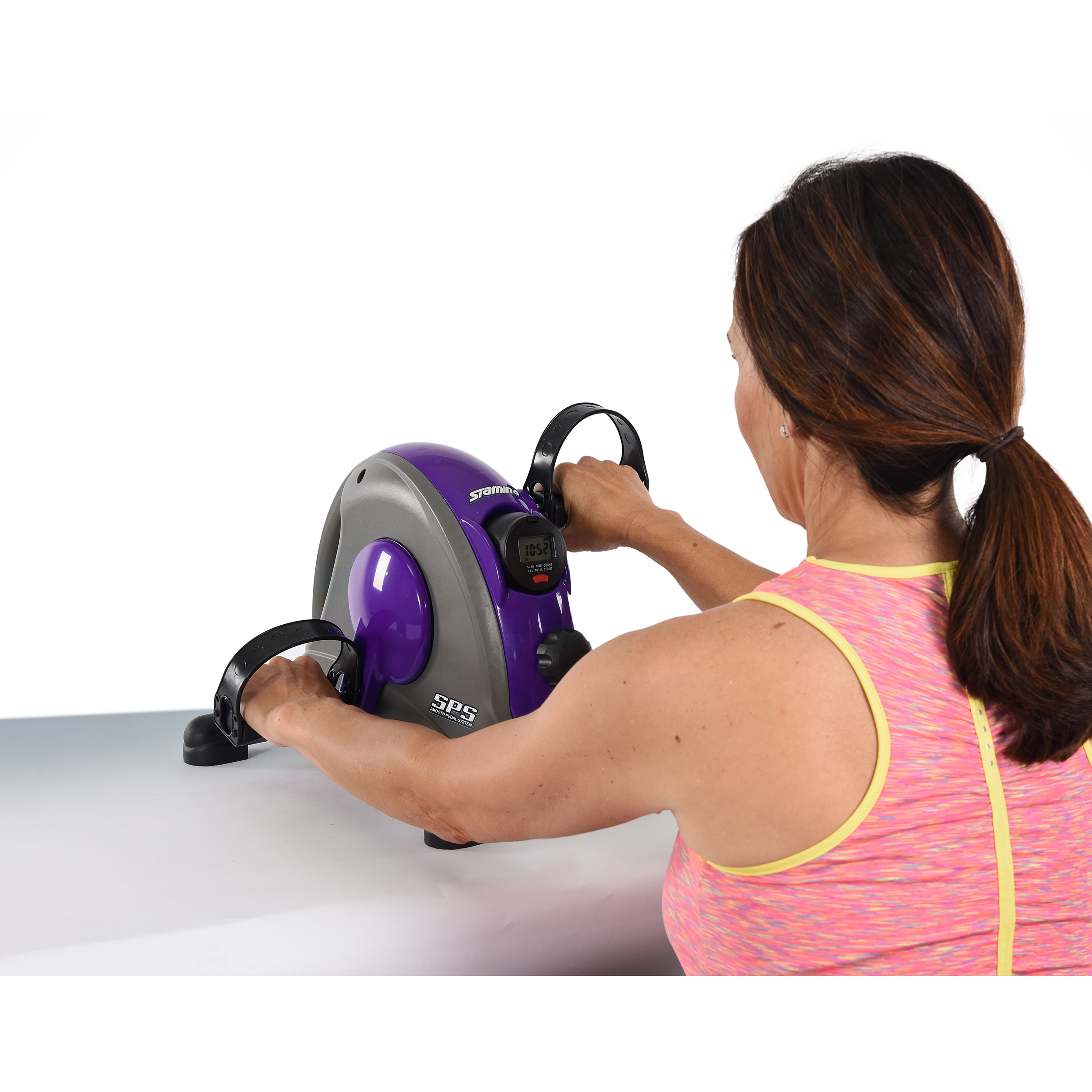 Woman exercising on Stamina Mini Exercise Bike Purple