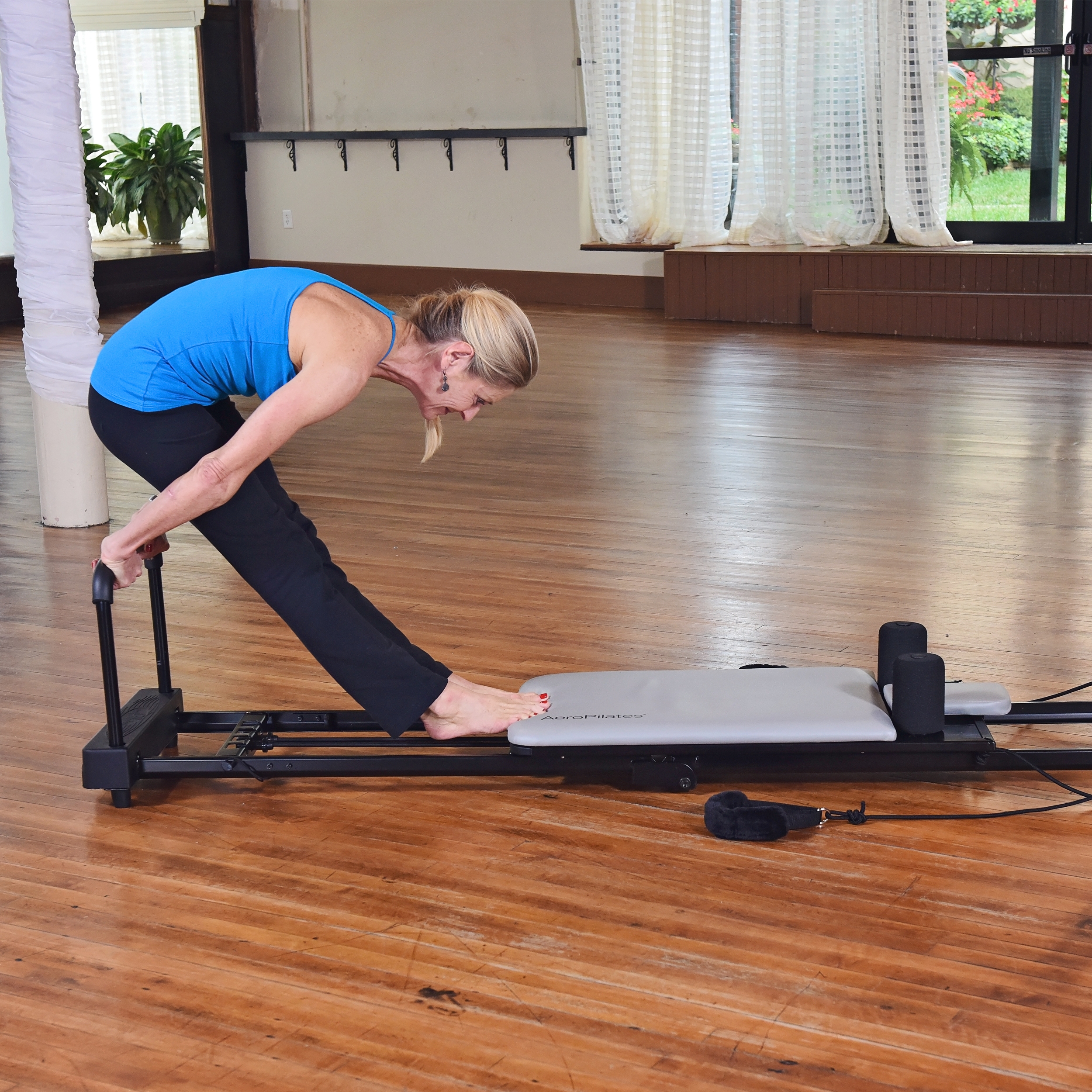Woman performing Simple Stretch AeroPilates workout