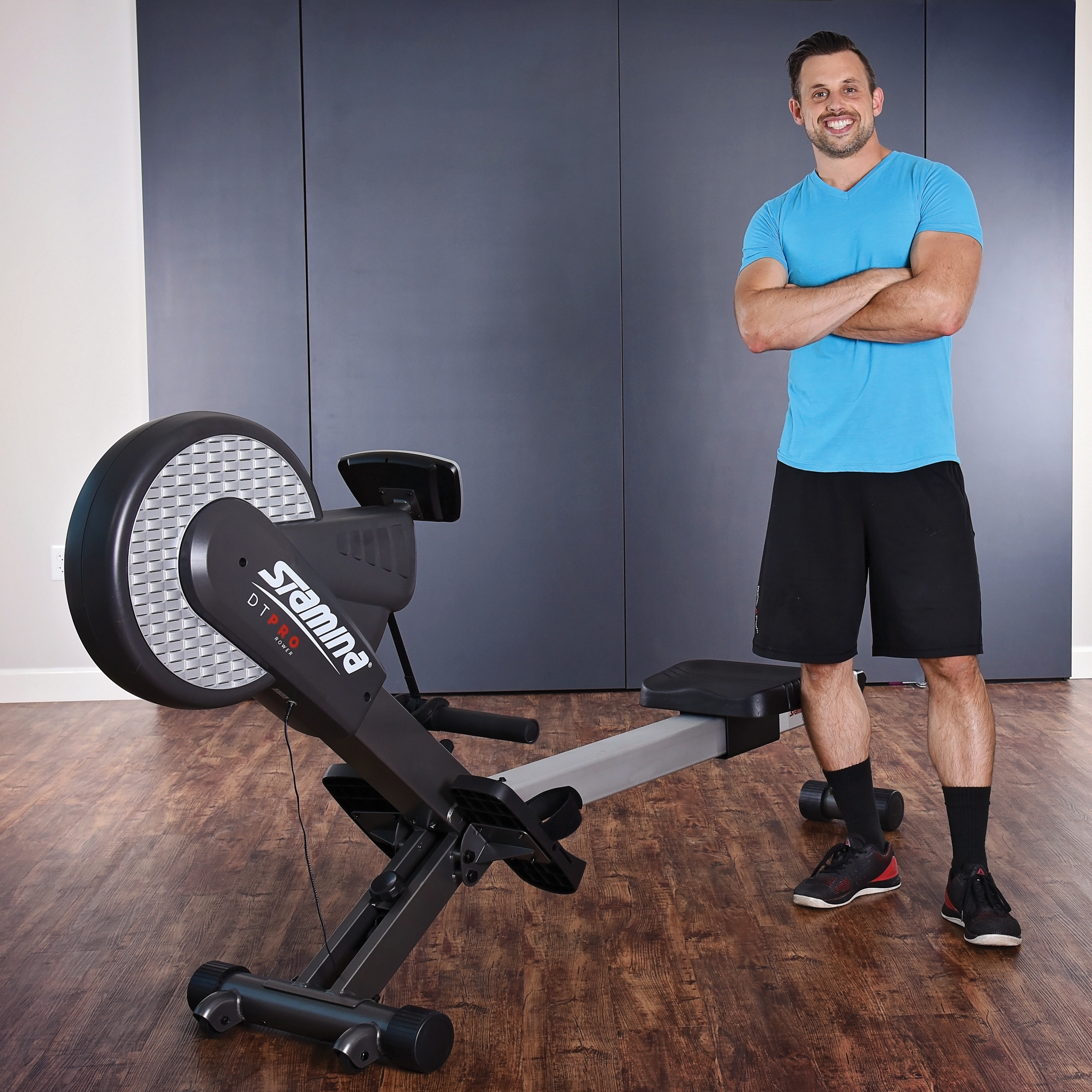 Middle age man standing beside on Stamina DT Pro Rower