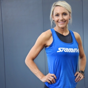 Woman smile and holding her hips.