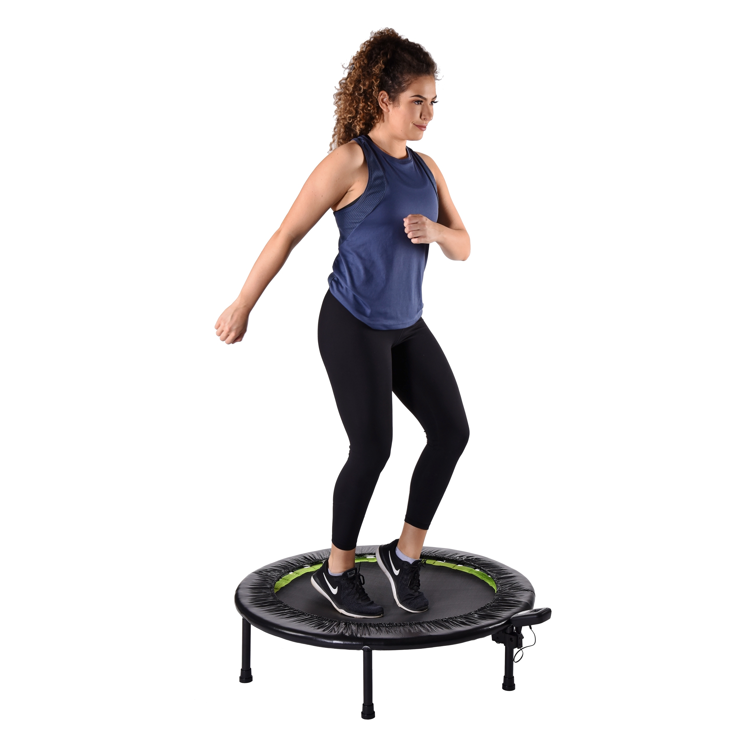 Woman arm straight downward while using trampoline.