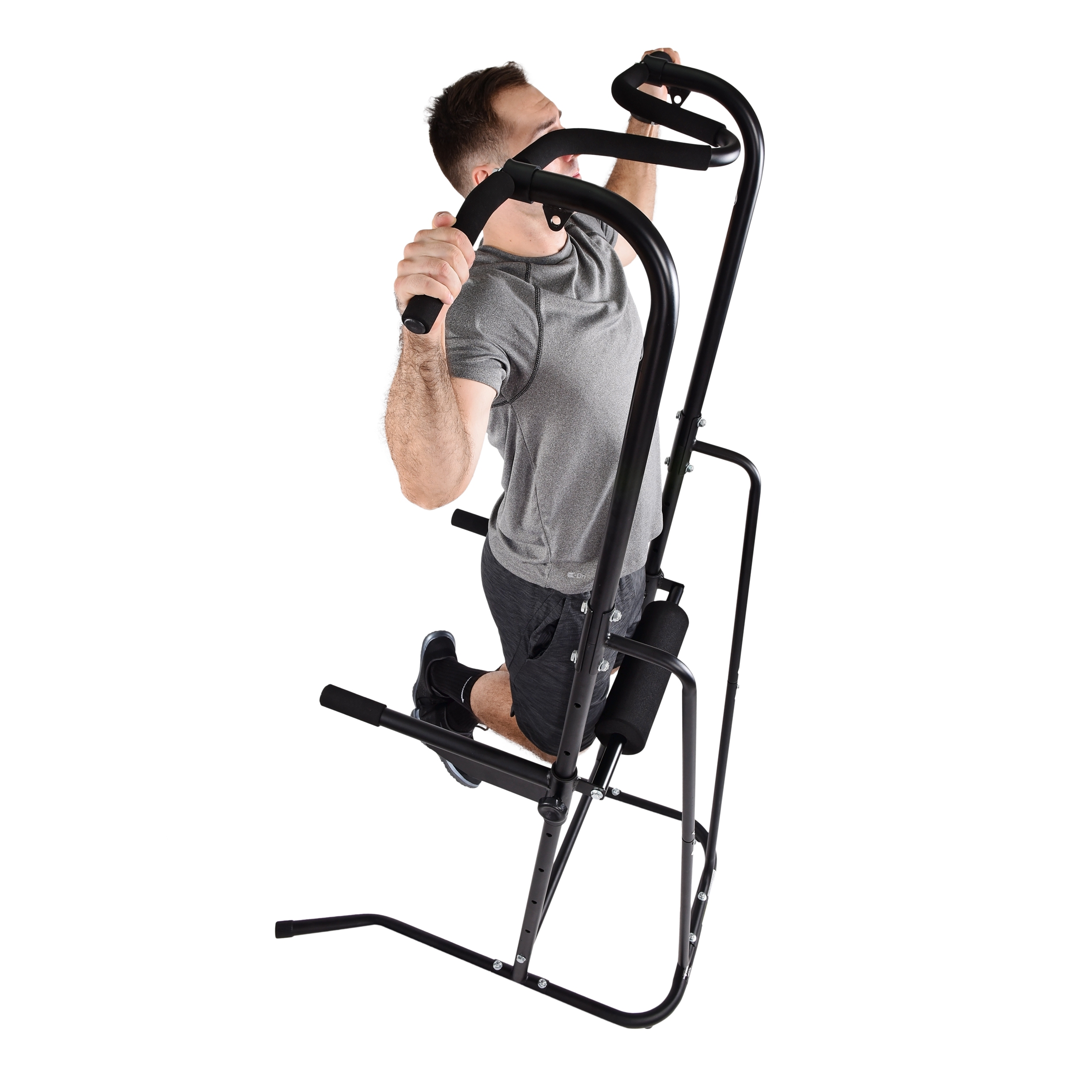 Man using the stamina power tower (pull up machine) on a white background.