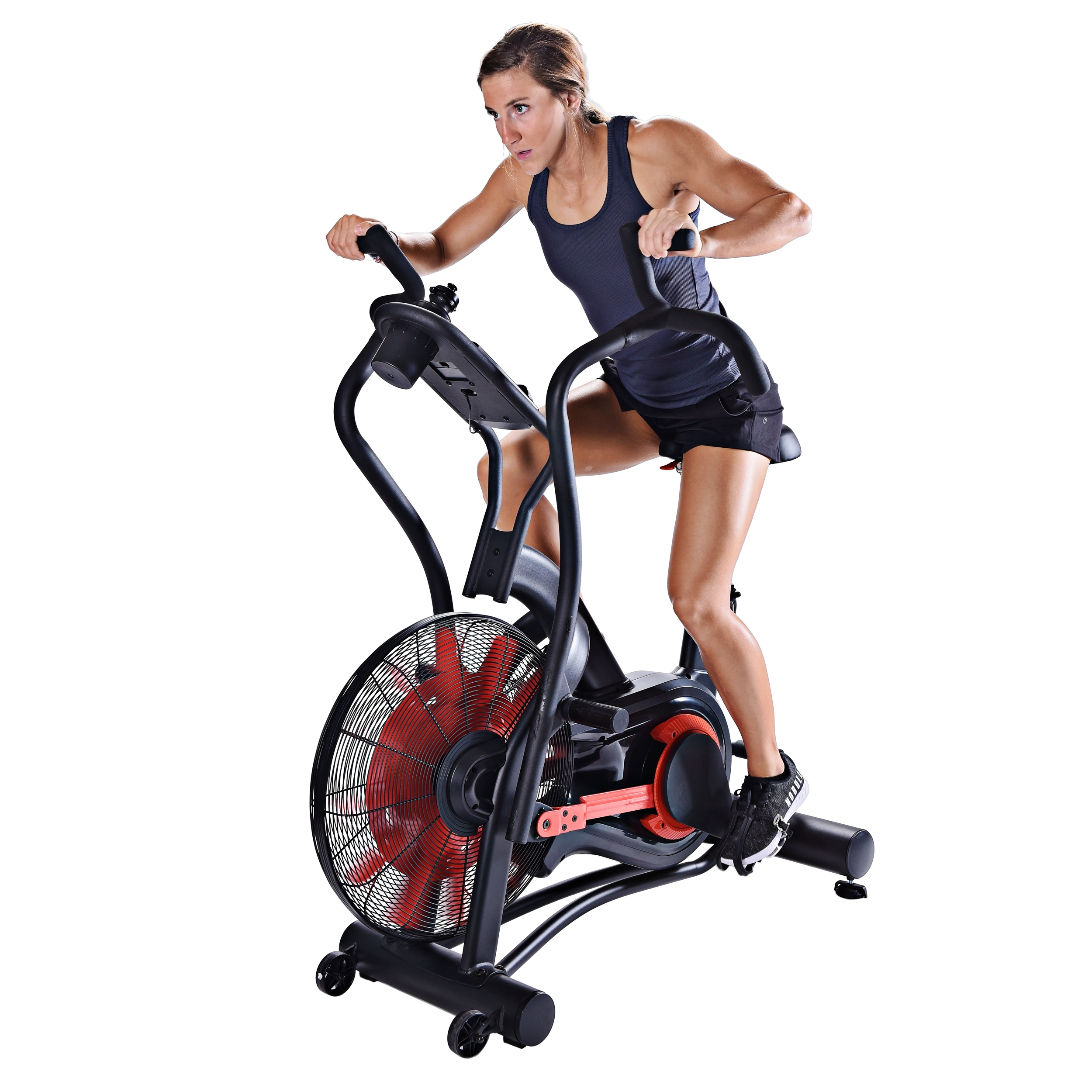 Young woman seated and cycling on Stamina X Air Bike Exercise.